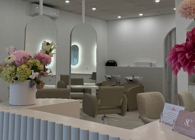 Chic interior of Haute Hair By Shelbie-Marie salon in Melbourne, Victoria, AU with vibrant floral decor.