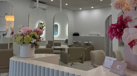 Chic interior of Haute Hair By Shelbie-Marie salon in Melbourne, Victoria, AU with vibrant floral decor.