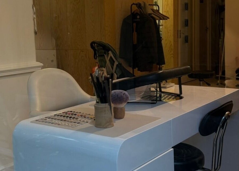 Elegant nail station at Lino, London, England, GB, featuring a modern white table and plush chair.