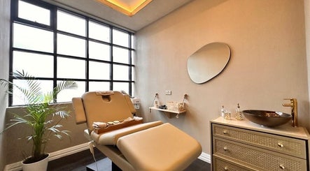 Relaxing therapy room at Therapy by aq, Birmingham, England, GB, featuring a plush treatment bed and tranquil decor.