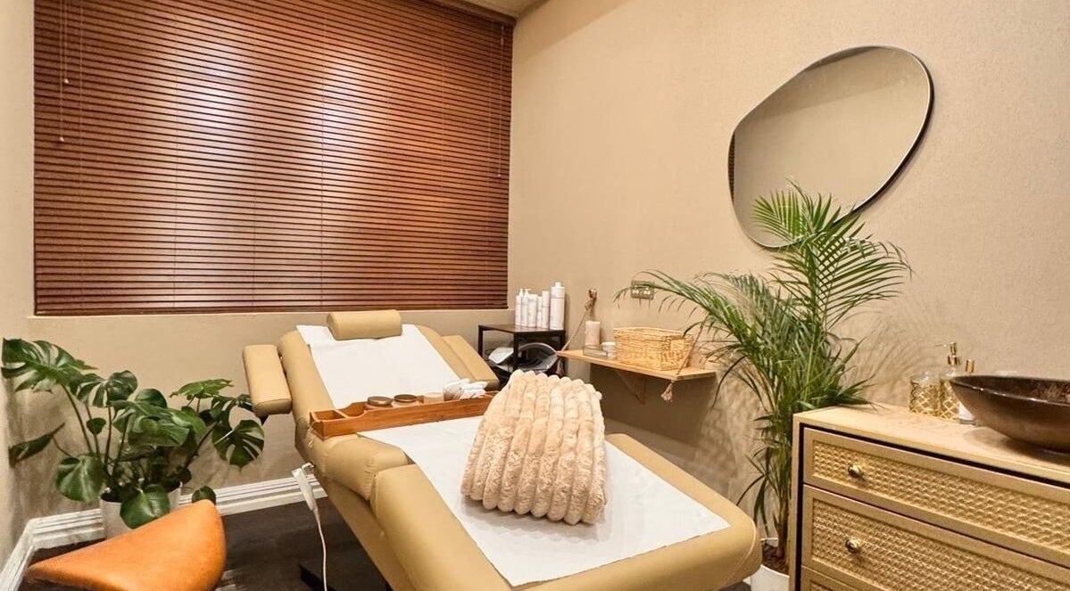 Relaxing therapy room at Therapy by Aq, Birmingham, England, GB with soothing decor and plush treatment bed.