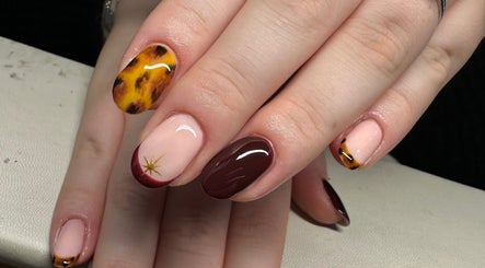 Stylish nail art at Nailchemi Beauty, Milton Keynes, England, GB, showcasing autumn-inspired designs.