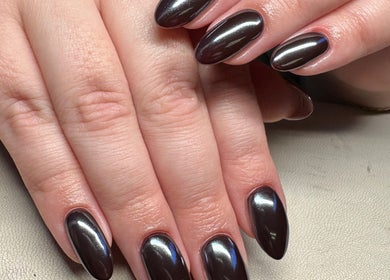 Elegant, glossy nails at Nailchemi Beauty in Milton Keynes, England, GB showcasing expert manicure services.