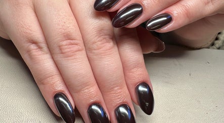 Elegant, glossy nails at Nailchemi Beauty in Milton Keynes, England, GB showcasing expert manicure services.
