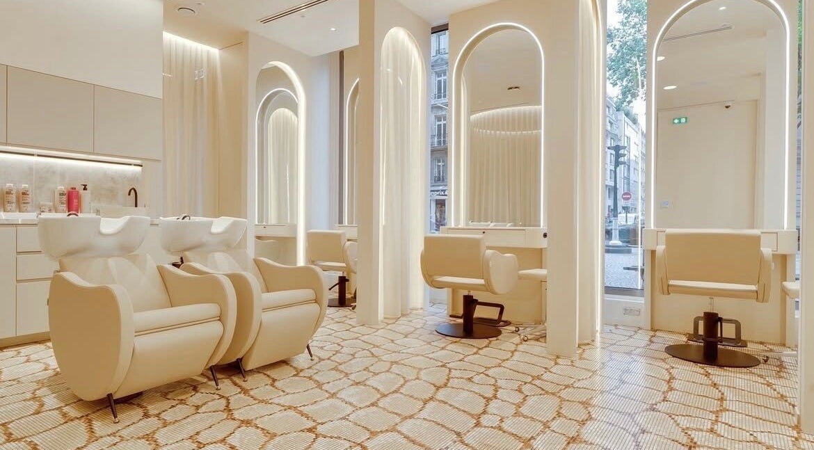 Luxurious salon interior at McKenzie Chun, Paris, Île-de-France, FR with chic styling stations.