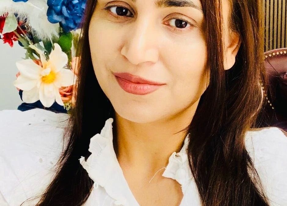 Woman smiling with elegant decor at MGB Aesthetic Clinic, Greater, England, GB.