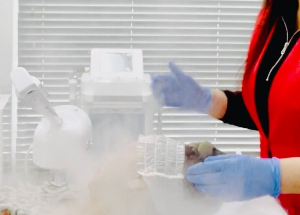 Aesthetician performs vapor facial at MGB Aesthetic Clinic, Greater, England, GB in serene treatment room.