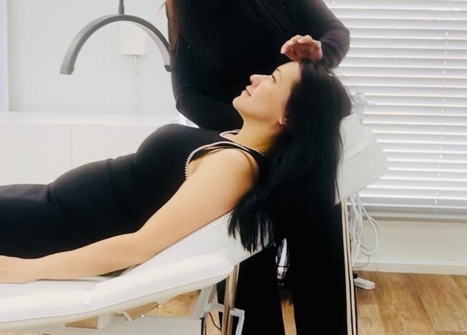Client enjoying treatment at MGB Aesthetic Clinic, Greater, England, GB