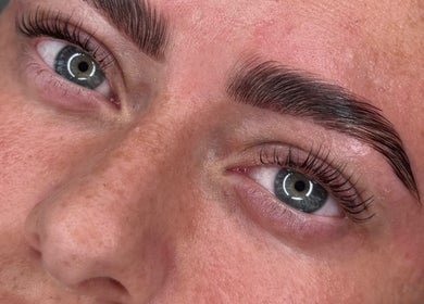 Close-up of perfectly shaped brows at By Ellie, Hemsworth, England, GB. Highlighting precision beauty care.