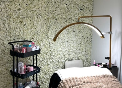 Cozy treatment area at Siennarubybeauty in Westerham, England, GB, with elegant floral wall decor.