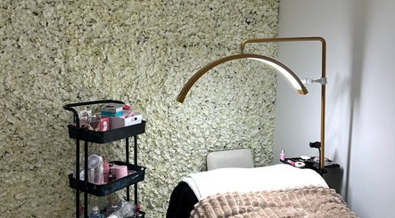 Cozy treatment area at Siennarubybeauty in Westerham, England, GB, with elegant floral wall decor.