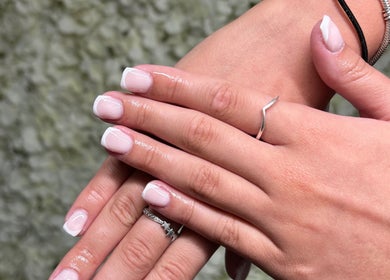 Manicured hands with elegant French tips at Siennarubybeauty, Westerham, England, GB.