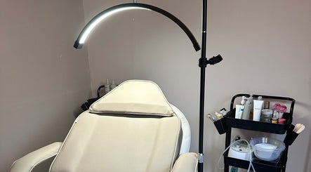 Treatment chair and tools at Glow Beauty by Sian, Solihull, England, GB, showcasing a serene setup.