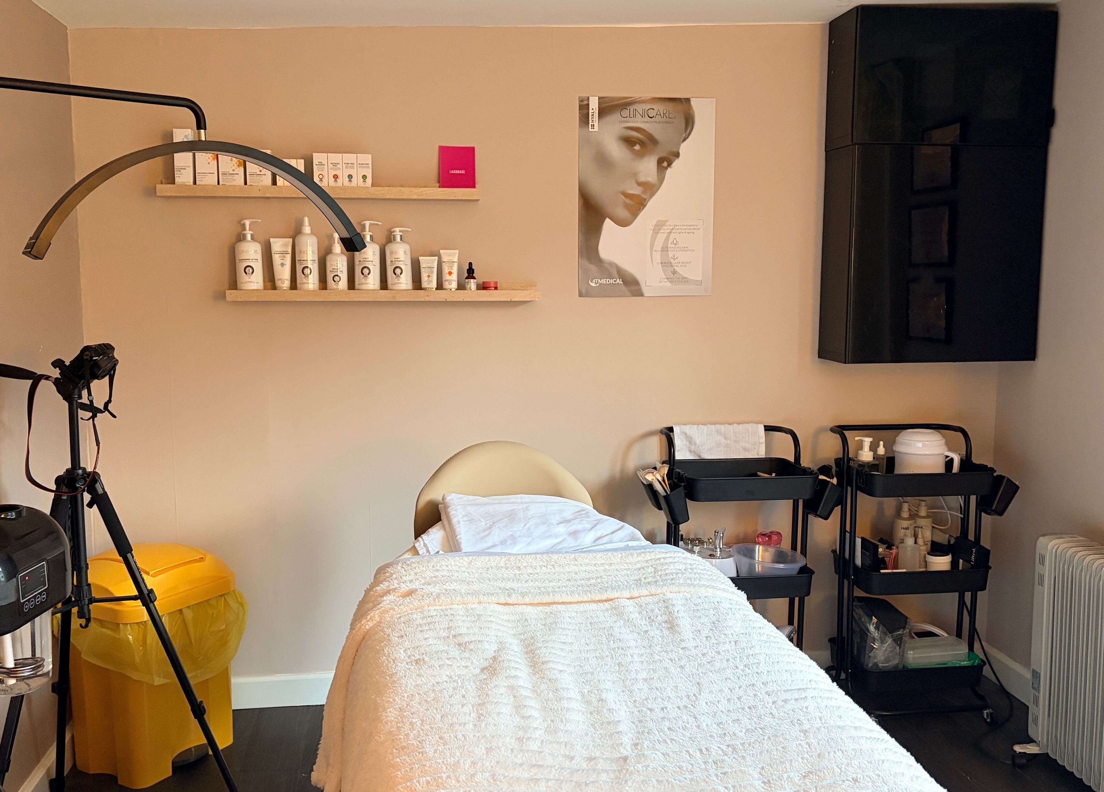 Calm treatment room at Glow Beauty by Sian, featuring soft lighting and professional skincare products in Solihull, England, GB.