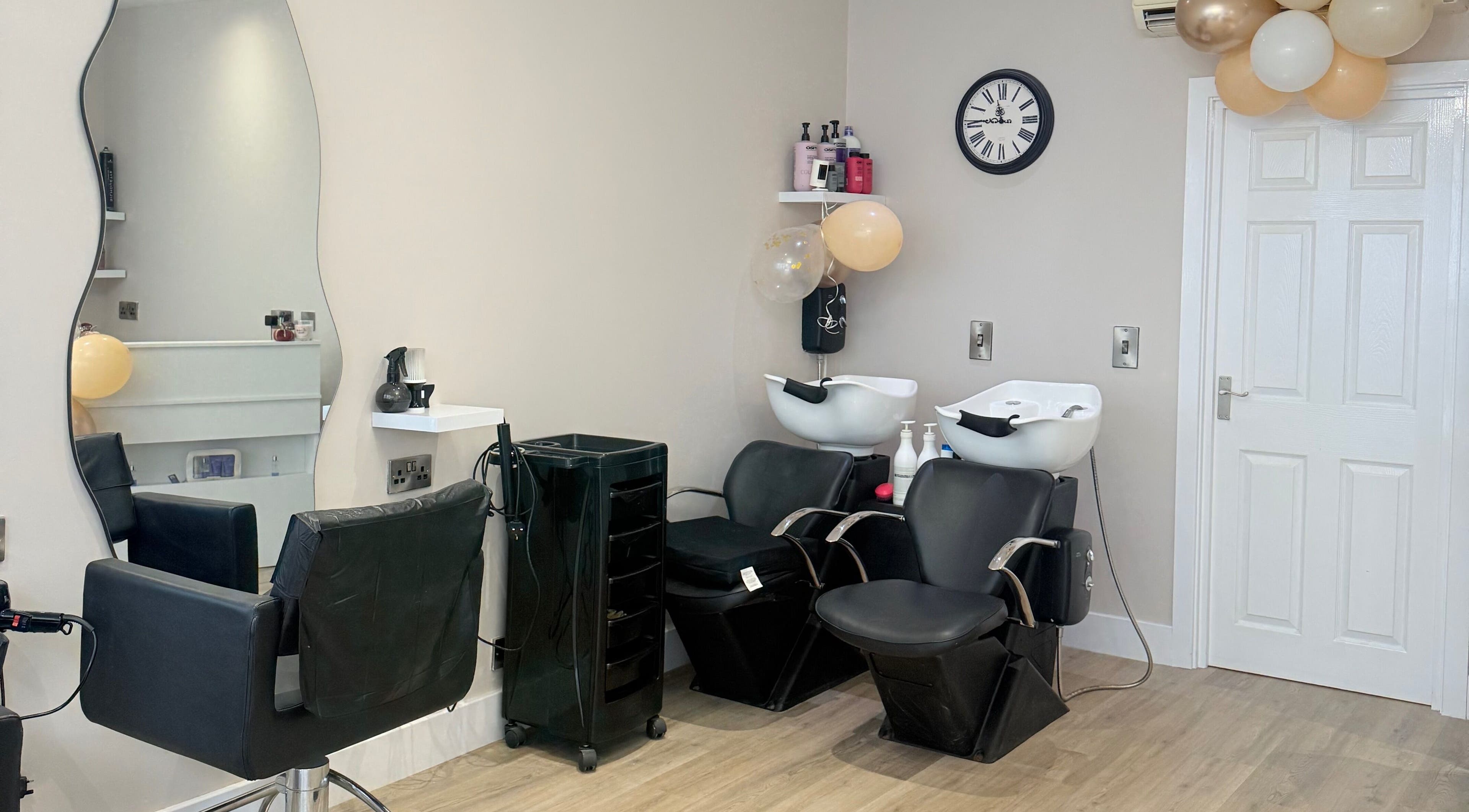 Dream Hair salon chairs and styling area in Huntingdon, England, GB.