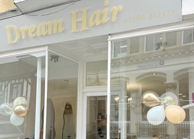 Exterior of Dream Hair salon in Huntingdon, England, showcasing modern design and stylish decor.