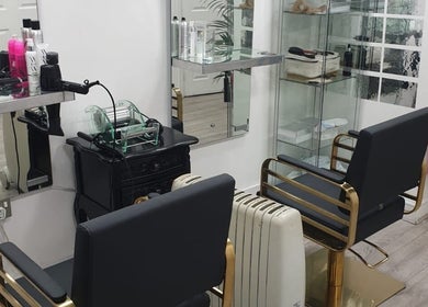 Modern salon chairs and hair products at Ray's House of Beauty Kingston, Kingston Upon Thames, England, GB.
