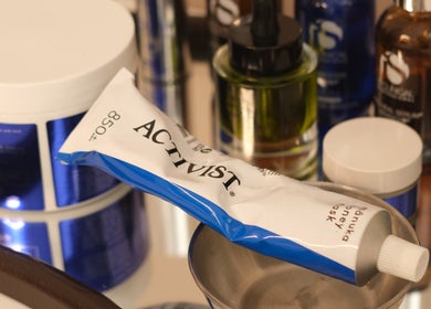 Luxury beauty products at Alma Aesthetics, Brighton And Hove, England, GB on a mirrored tray.