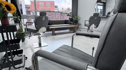 Modern salon seating at Hairbymia.at.apollo, Taunton, England, GB with stylish decor and natural light.