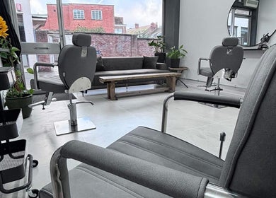 Modern salon interior at Hairbymia.at.apollo, Taunton, England, GB. Stylish chairs and bright ambiance.
