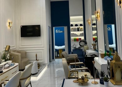 Chic interior of Lumiere Ladies Salon in Dubai, AE featuring luxurious styling chairs and modern decor.