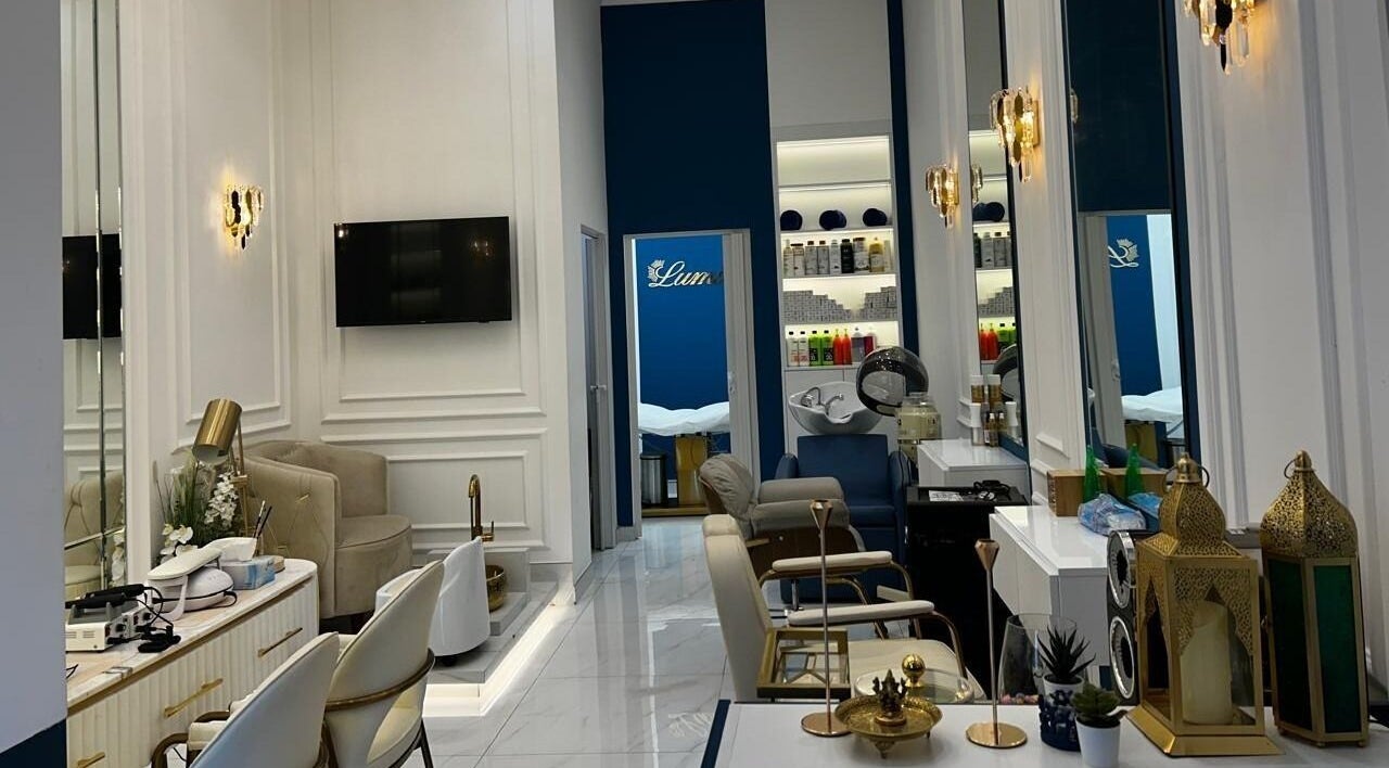 Chic interior of Lumiere Ladies Salon in Dubai, AE featuring luxurious styling chairs and modern decor.
