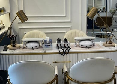 Elegant nail station at Lumiere Ladies Salon, Dubai, AE showcasing luxury manicure setup.