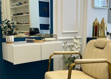 Luxurious salon chair at Lumiere Ladies Salon, Dubai, AE, with chic decor enhancing ambiance.