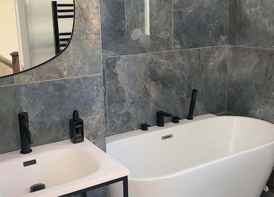 Sleek bathroom at Maid For It, Widnes, England, GB with modern tub and stylish finishes.