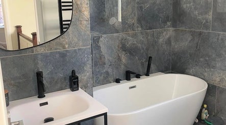 Sleek bathroom at Maid For It, Widnes, England, GB with modern tub and stylish finishes.