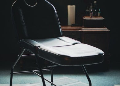 Luxury massage chair at Enchantress, Shelbyville, Tennessee, US with ambient lighting.