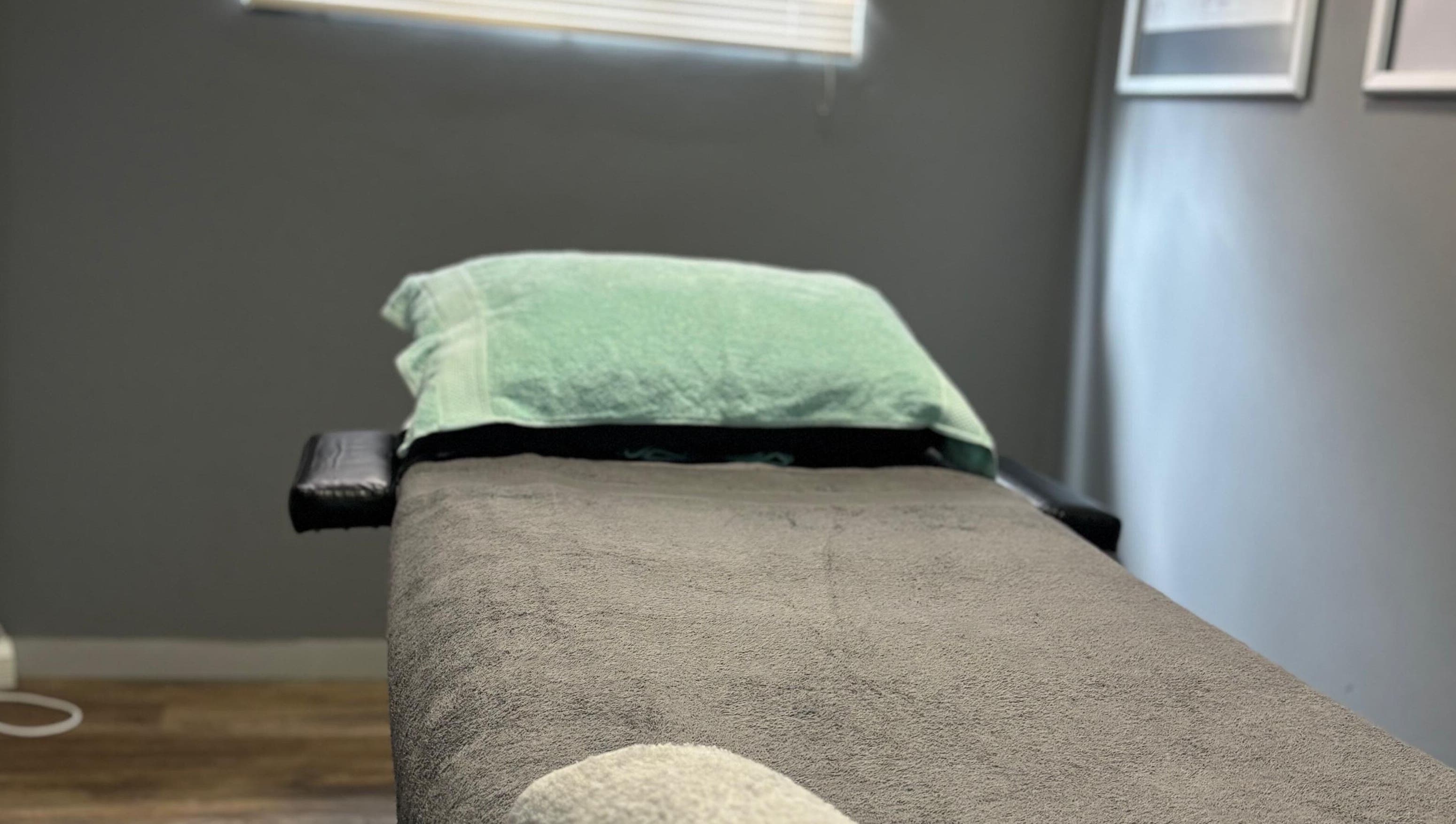 Massage bed at Once Active Gym in Sandton, Gauteng, ZA, offers a serene setting for relaxation.