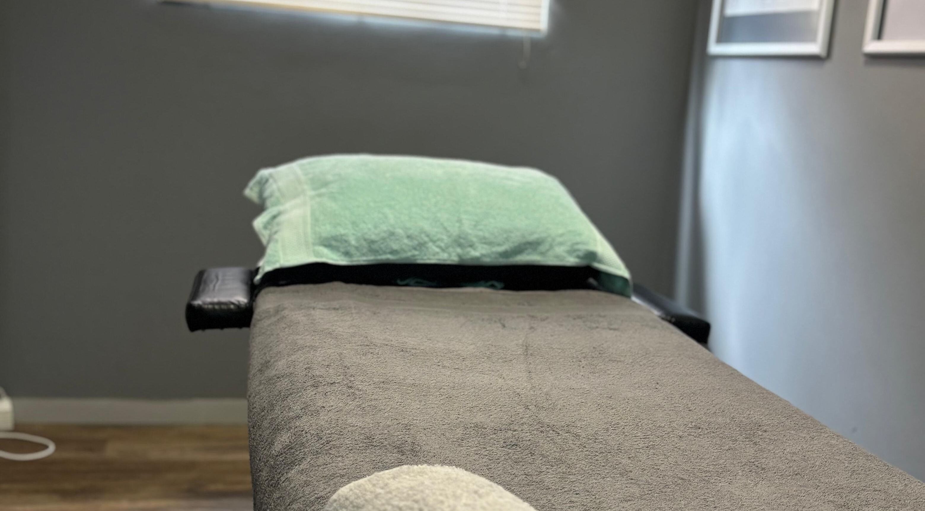 Massage bed at Once Active Gym in Sandton, Gauteng, ZA, offers a serene setting for relaxation.