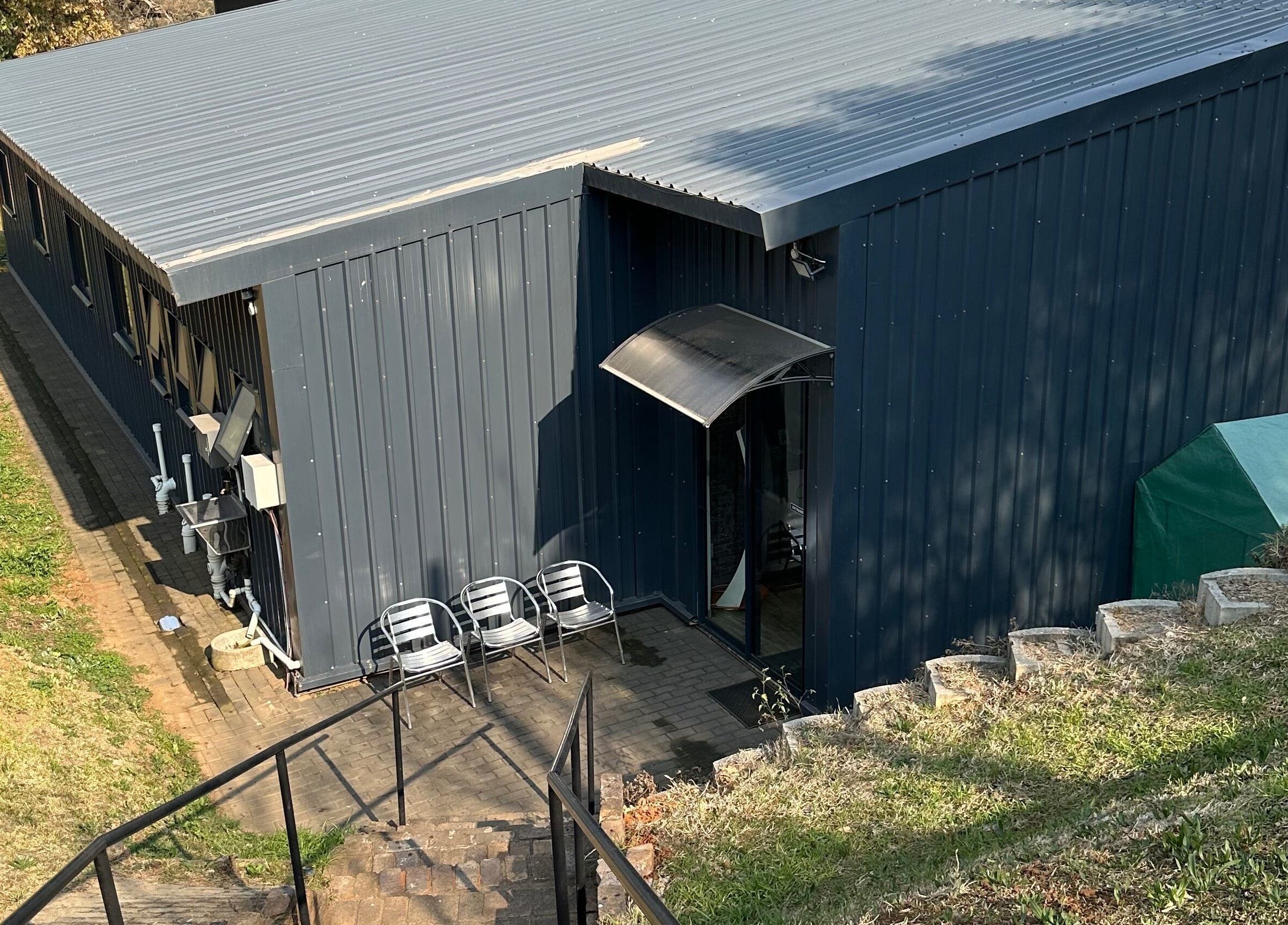 Exterior of Once Active Gym, Sandton, Gauteng, ZA showing sleek, modern architecture and seating area.