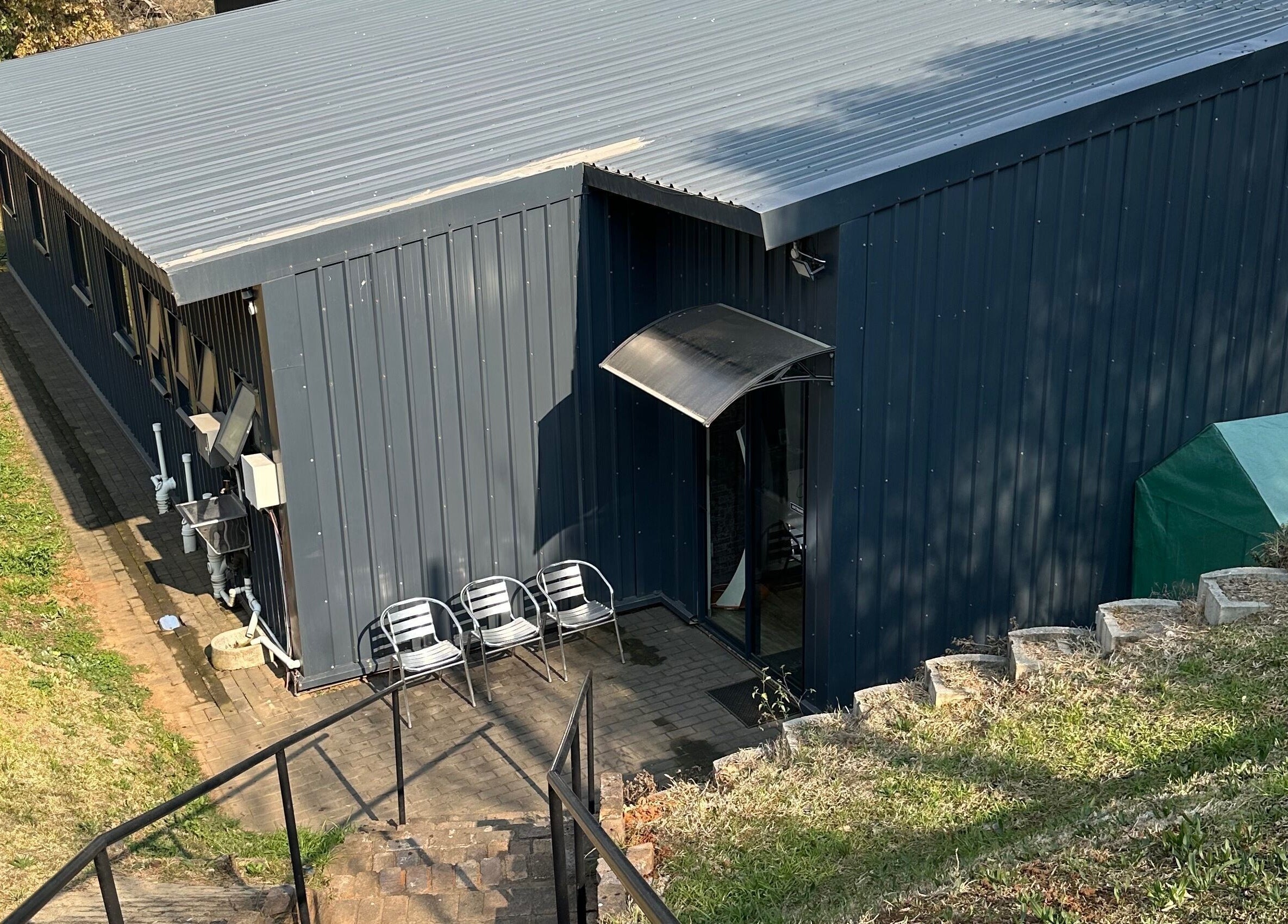 Exterior of Once Active Gym, Sandton, Gauteng, ZA showing sleek, modern architecture and seating area.