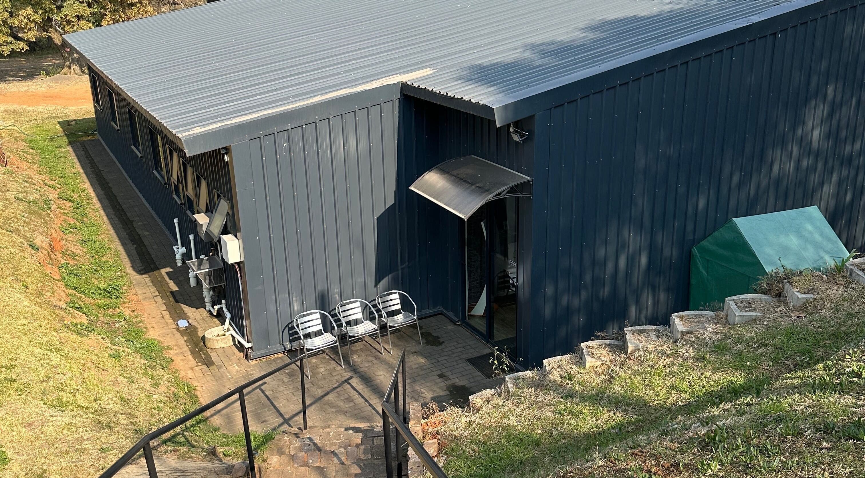 Exterior of Once Active Gym, Sandton, Gauteng, ZA showing sleek, modern architecture and seating area.