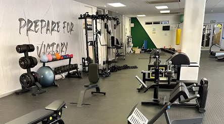 Modern gym at Wanderers Sports Medical Centre, Johannesburg, Gauteng, ZA, with a variety of exercise equipment.