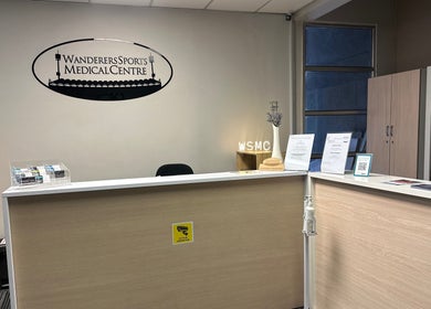 Reception area of Wanderers Sports Medical Centre in Johannesburg, Gauteng, ZA with signage and brochures.