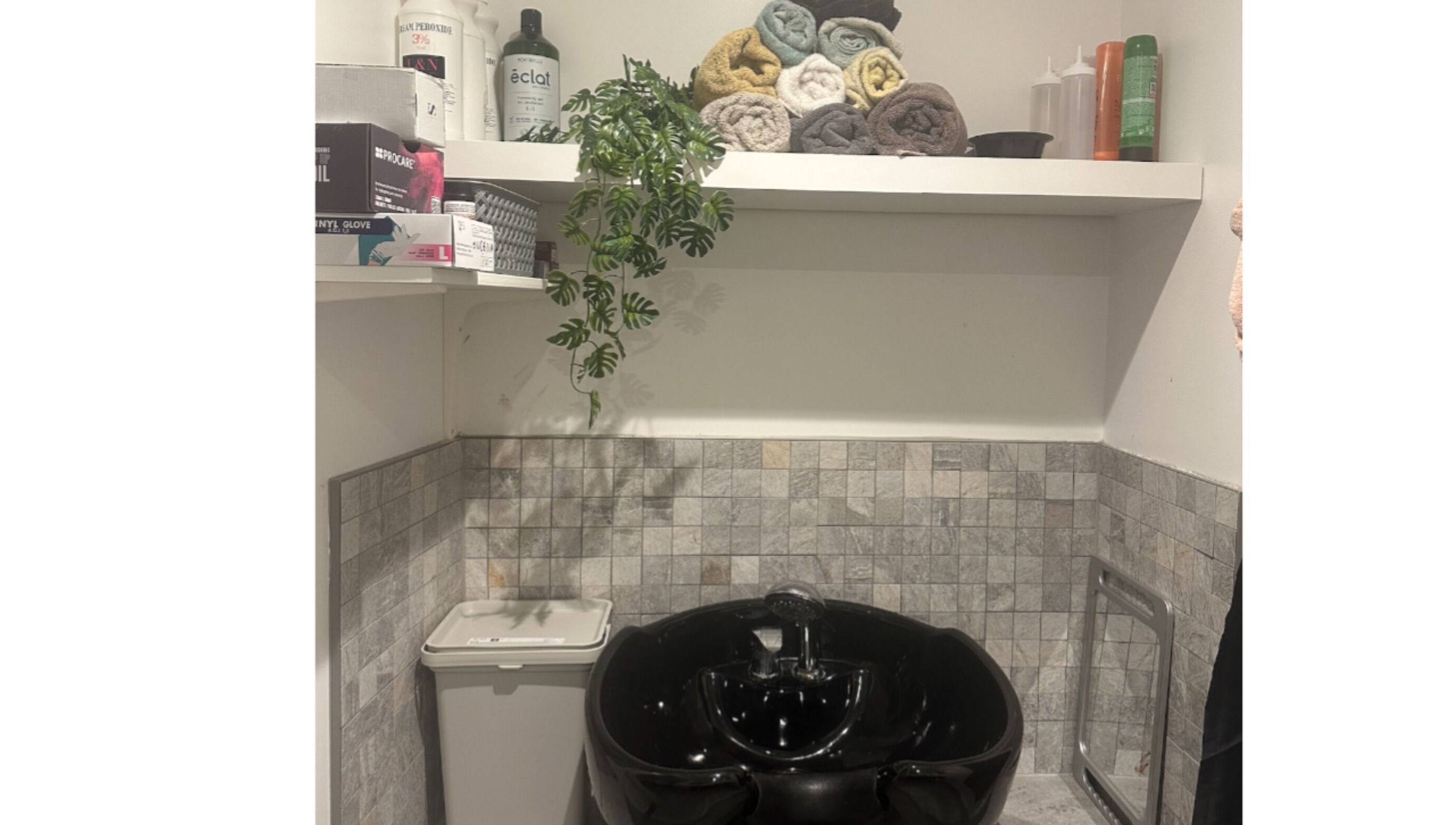 Relaxing spa wash area at Hair.by.kitty, Bletchley, England, GB with stylish sink and accessories.