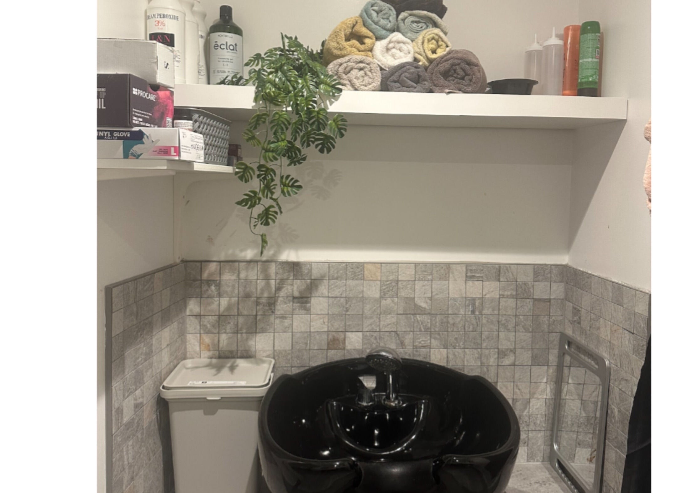 Relaxing spa wash area at Hair.by.kitty, Bletchley, England, GB with stylish sink and accessories.