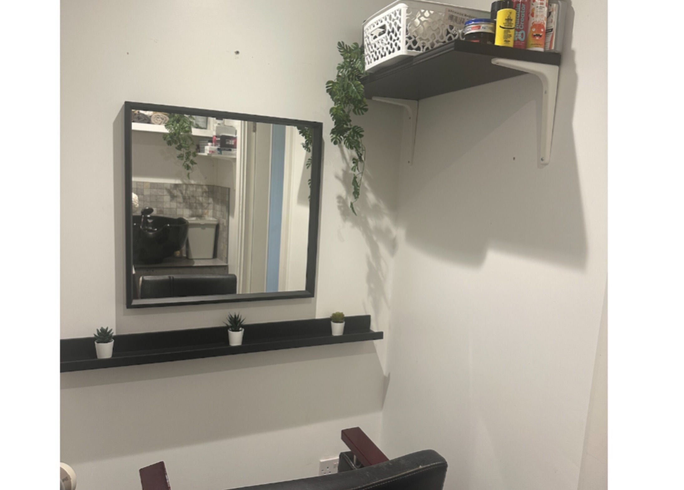 Elegant styling station at Hair.by.kitty in Bletchley, England, GB, featuring a mirror and chic decor.