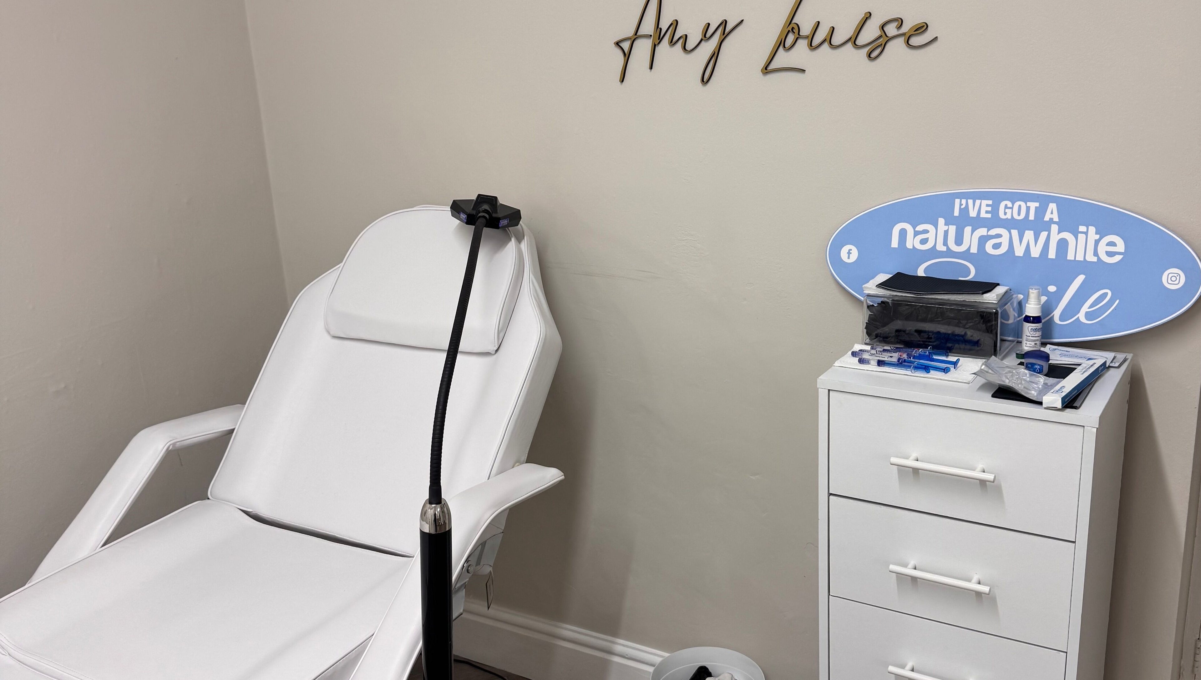 B-Radiant's serene whitening room featuring a white chair and accessories in Briton Ferry, Wales, GB.