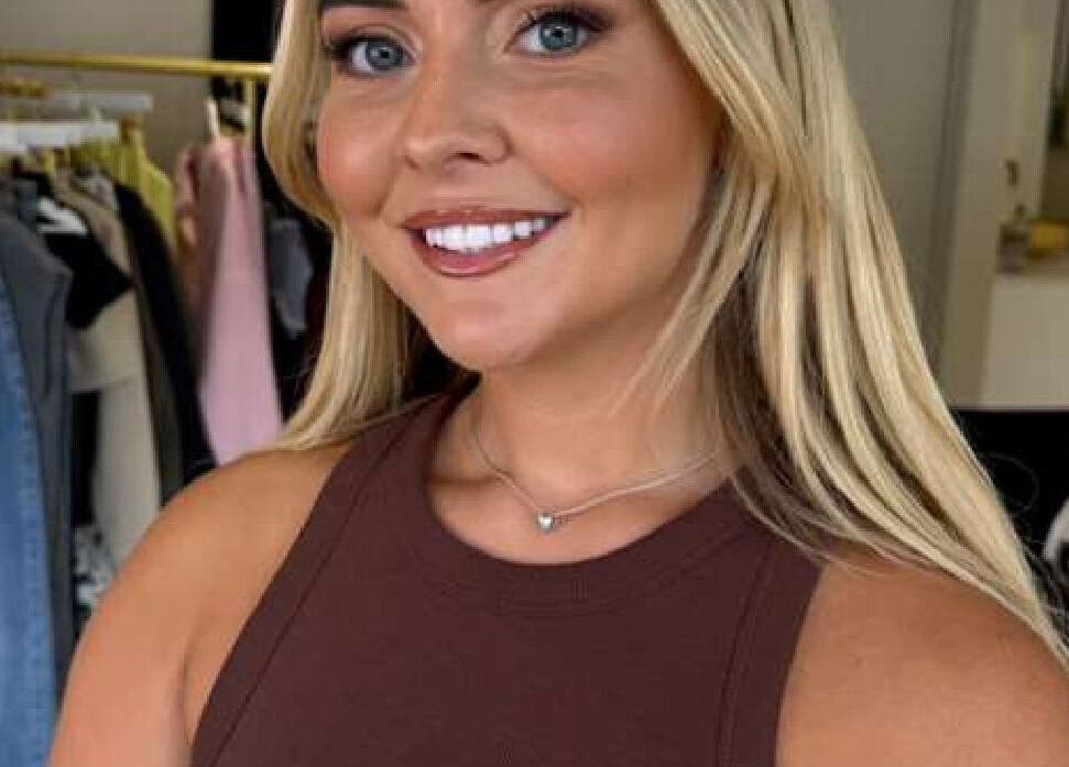 Smiling woman with polished makeup at Marriage Material Make up, Dartford, England, GB.