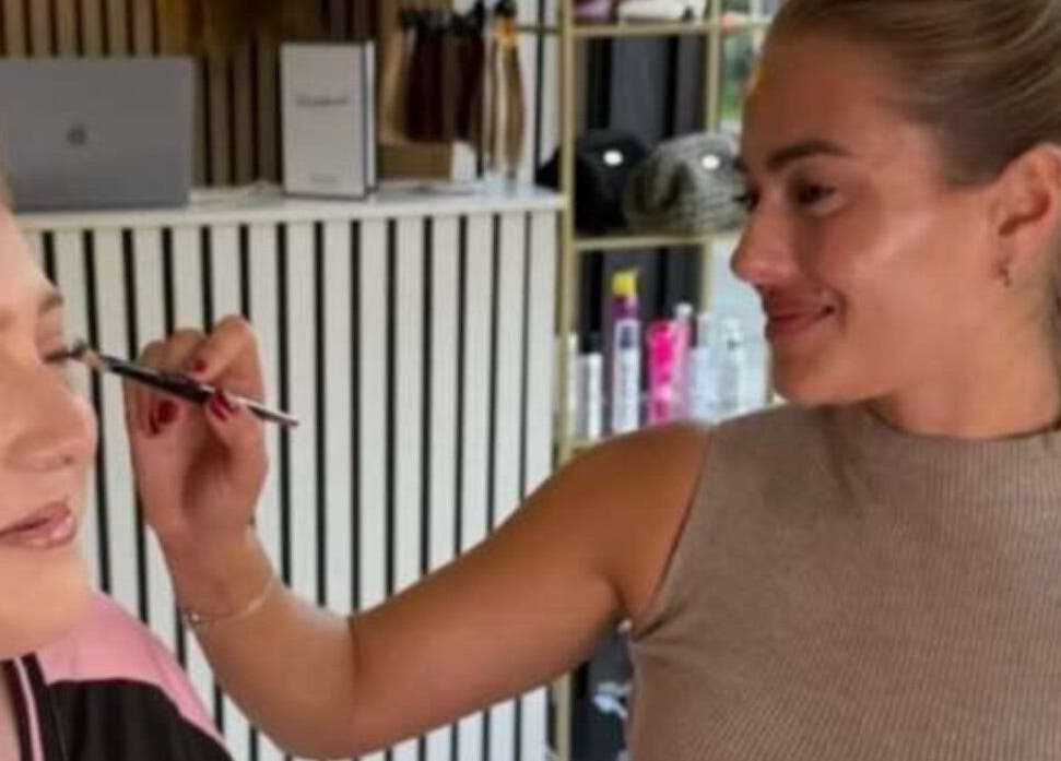 Makeup artist perfecting look at Marriage Material Make up, Dartford, England, GB.