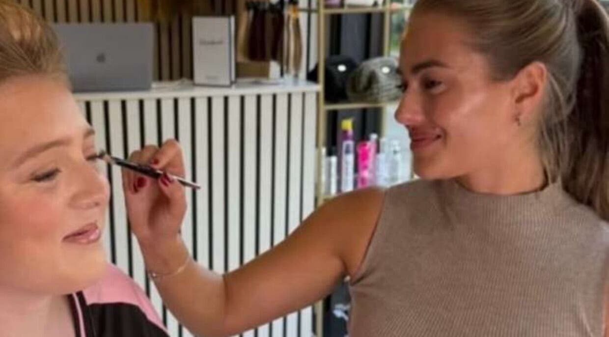 Makeup artist perfecting look at Marriage Material Make up, Dartford, England, GB.