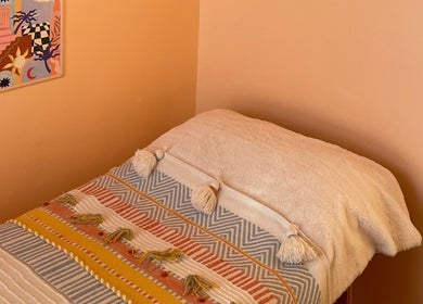 Comfortable massage bed at Sole Therapy Wirral, Wallasey, England, GB with vibrant decor.