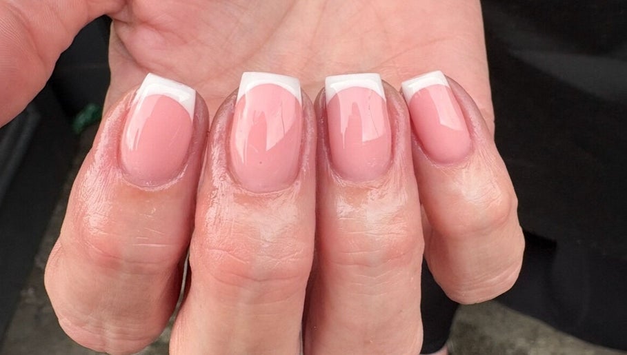 Elegant French manicure at AnnaRaeBeauty in Paisley, Scotland, GB, showcasing glossy pink and white nails.