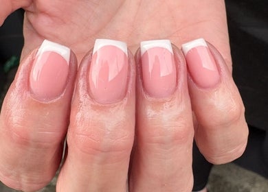 Elegant French manicure at AnnaRaeBeauty in Paisley, Scotland, GB, showcasing glossy pink and white nails.