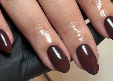 Elegant maroon manicure at AnnaRaeBeauty in Paisley, Scotland, GB. Expert nail care and design.