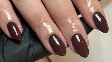 Elegant maroon manicure at AnnaRaeBeauty in Paisley, Scotland, GB. Expert nail care and design.